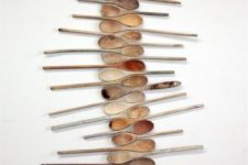 24 colored wooden spoons wall art