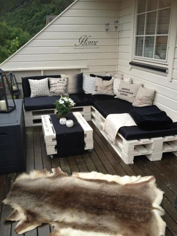 white pallet furniture for a rooftop terrace can be DIYed easily and looks cute and rustic