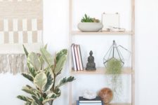 28 a shelving unit with greenery on each shelf looks fresh and modern