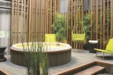 28 a stylish wooden deck with steps and a jacuzzi, a living green wall