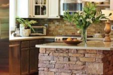 29 a brick clad kitchen island with a stone top looks textural