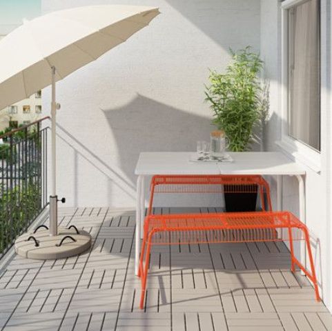 VÄSTERÖN benches by Ikea in bold orange bring cheer to this space