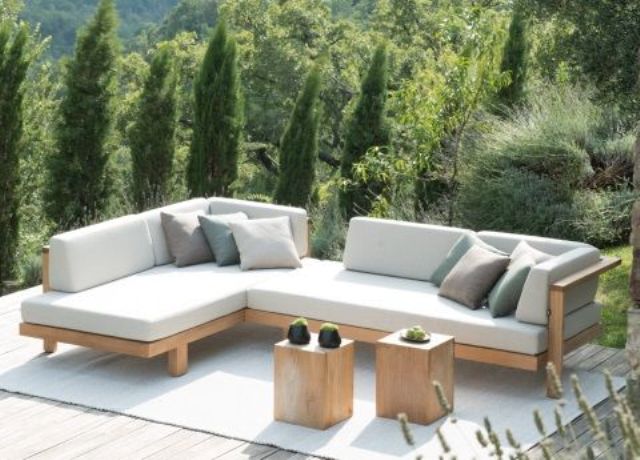 small light-colored tall rectangle tables reminding of stumps