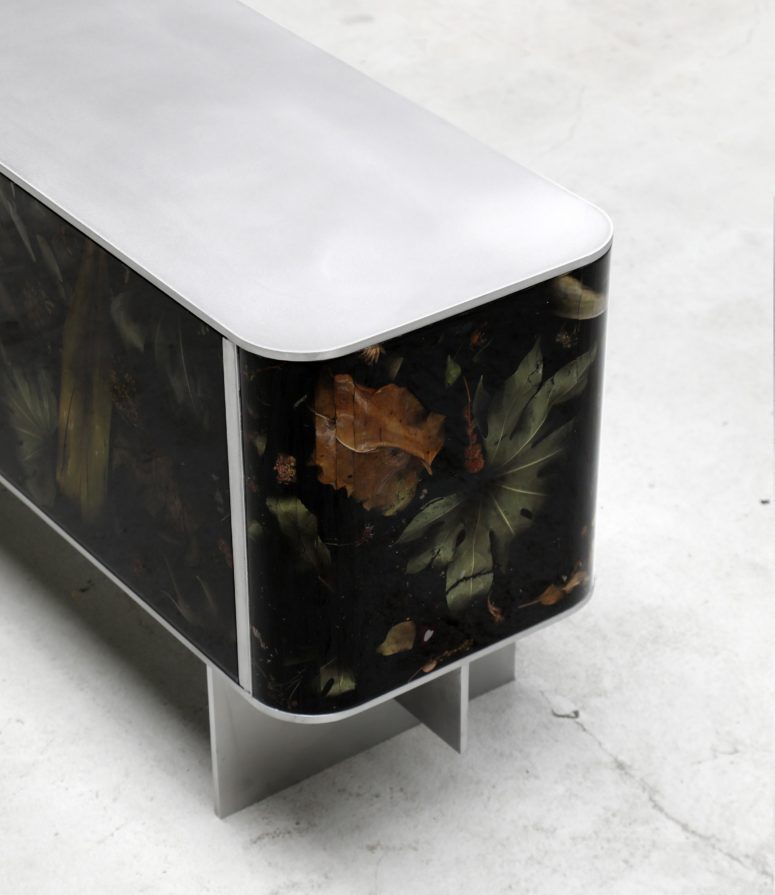 The contrast between coated steel and moody resin and flora parts is amazing