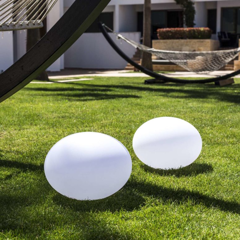 portable lamps The piece is rechargeable and color-changing, and it can be placed anywhere, from your dining table to the grass around your pool
