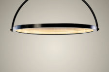 03 The disk pivots to different angles, changing how it looks and functions, so it works as a light or as a mirror