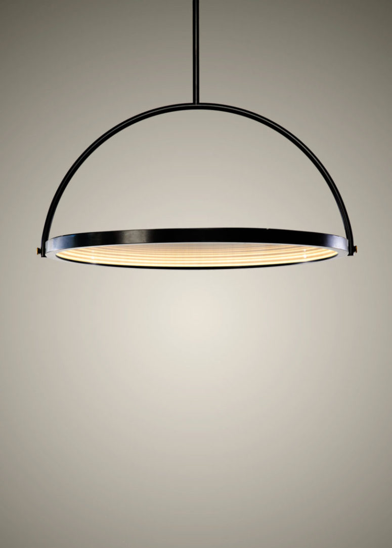 The disk pivots to different angles, changing how it looks and functions, so it works as a light or as a mirror