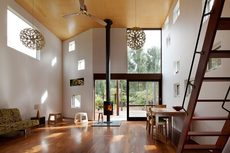 The hearth makes it cozier and warmer, and large carved pendant lamps highlight the super high ceilings