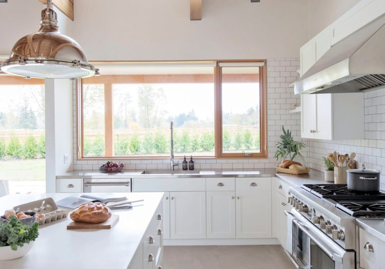 There are large windows everywhere, they bring much natural light in, and light wood frames echo with beams on the ceiling There are large windows everywhere, they bring much natural light in, and light wood frames echo with beams on the ceiling