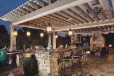 03 cozy lanterns hanging from the pergola above the kitchen