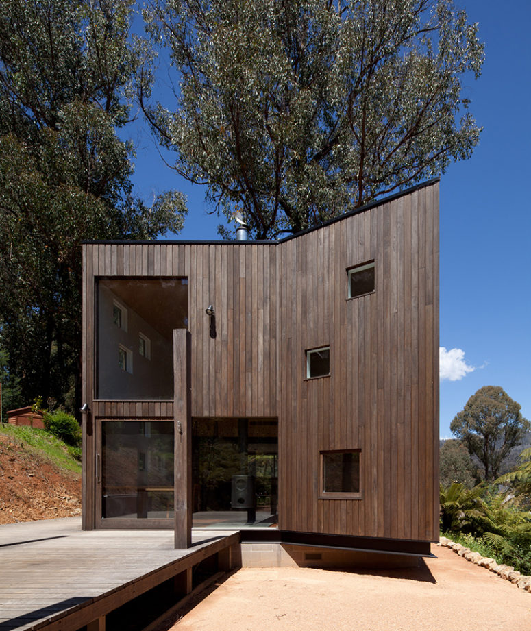 The house is opened to outdoors and there's a large deck clad with the same wood, it's a perfect vacation home