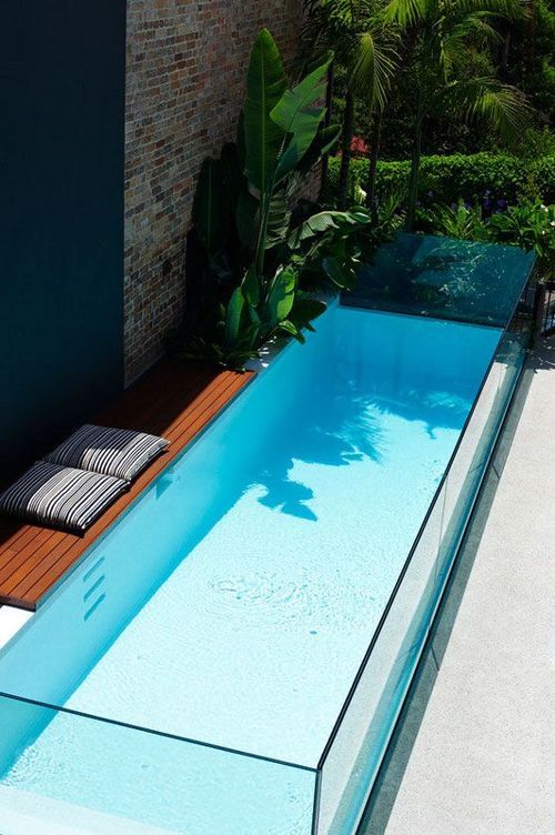 small narrow glass pool will make a modern statement in the tiniest backyard