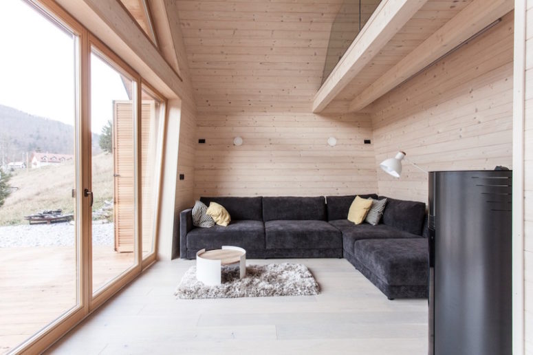 room with a view A glazed wall brings much natural light in and makes the interiors connected to the outdoor spaces