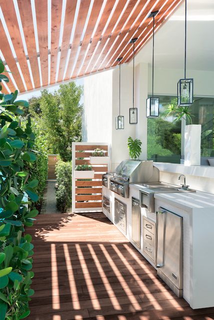 modern box pendant lamps hanging over the cooking area