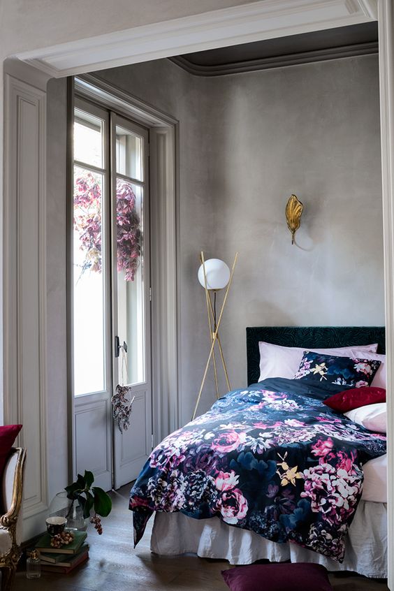 navy bedding with beautiful pink flowers on it
