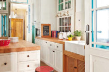 07 The kitchen is vintage meets mid-century modern, with traditional white cabinets and warm wood counters