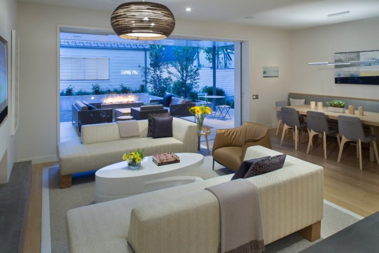 The living space is united with the dining space and it may be opened to a large terrace with a fire pit The living space is united with the dining space and it may be opened to a large terrace with a fire pit