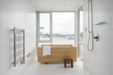 07 There’s a master bathroom with gorgeous views and a wooden soak tub in Japanese style
