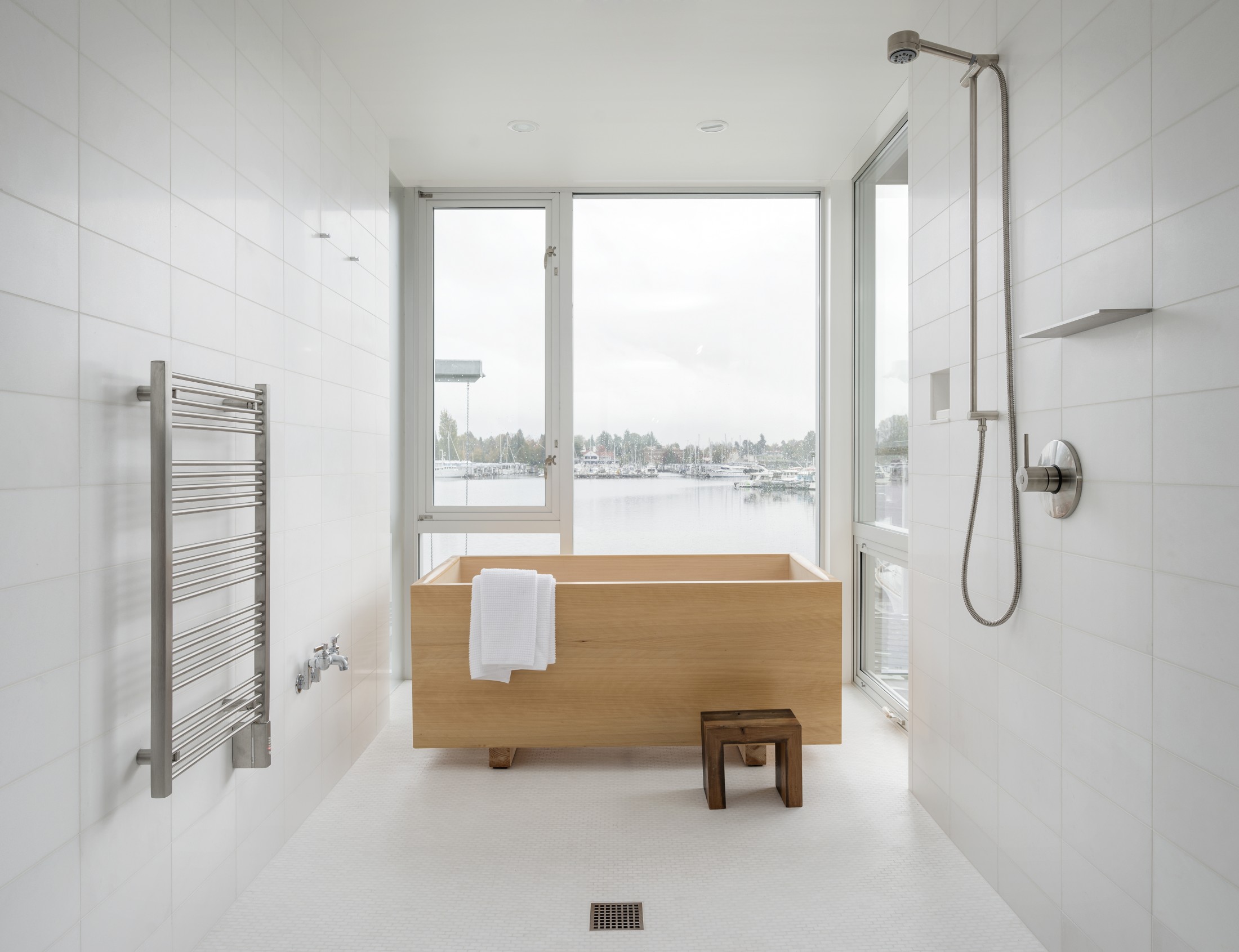 There's a master bathroom with gorgeous views and a wooden soak tub in Japanese style
