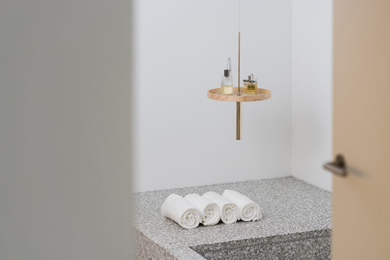 The circulum ceiling shelf used in the bathroom in white marble