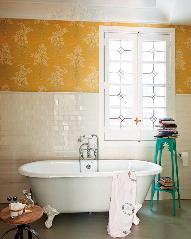 The bathroom shows how to blend simple white tiles, stucco and floral wallpaper right to leave an impression