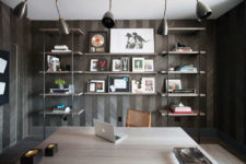 10 The home office is dark and moody, with unique wallpaper imitating reclaimed wood clad in a chevron pattern