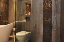 10 sparkling copper hexagon tiles accentuate the shower and niches