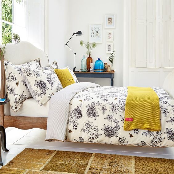 cream and black floral bedding reminds of vintage