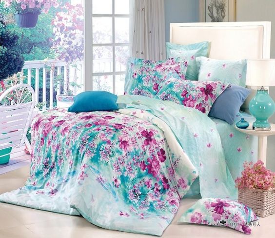 dreamy aqua-colored bedding with pink floral prints looks wow