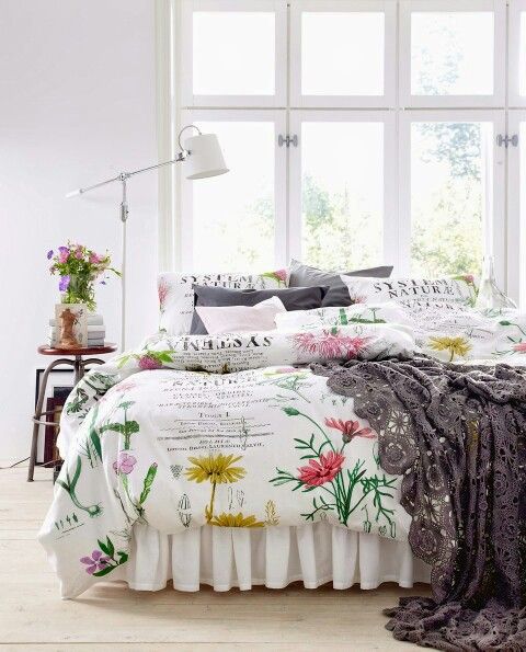 romantic red and yellow floral bedding with grey and floral pillows