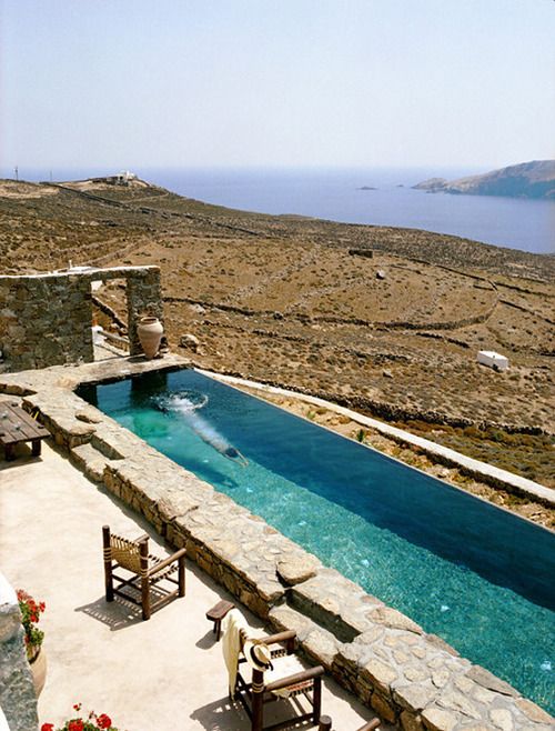nature-inspired stone clad narrow pool with a view to the desert and sea