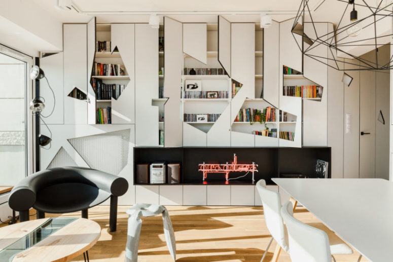 The cabinets received unique cutout front panels that highlighted the style of the apartment and gave it more personality The cabinets received unique cutout front panels that highlighted the style of the apartment and gave it more personality