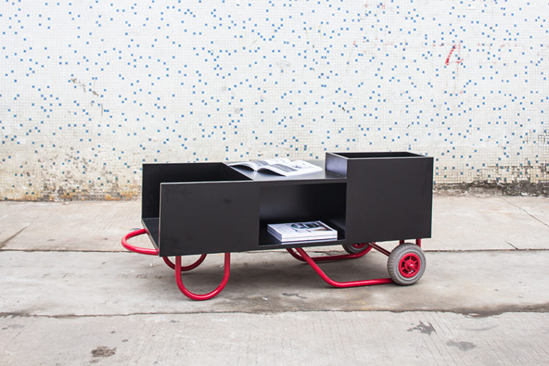 The coffee table which also serves as a bookshelf when upright