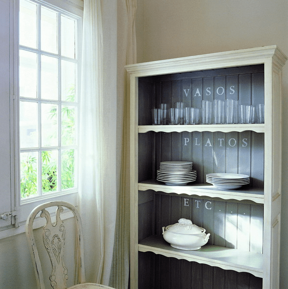 pastel green cupboard with no glass and dark grey inside for a contrast