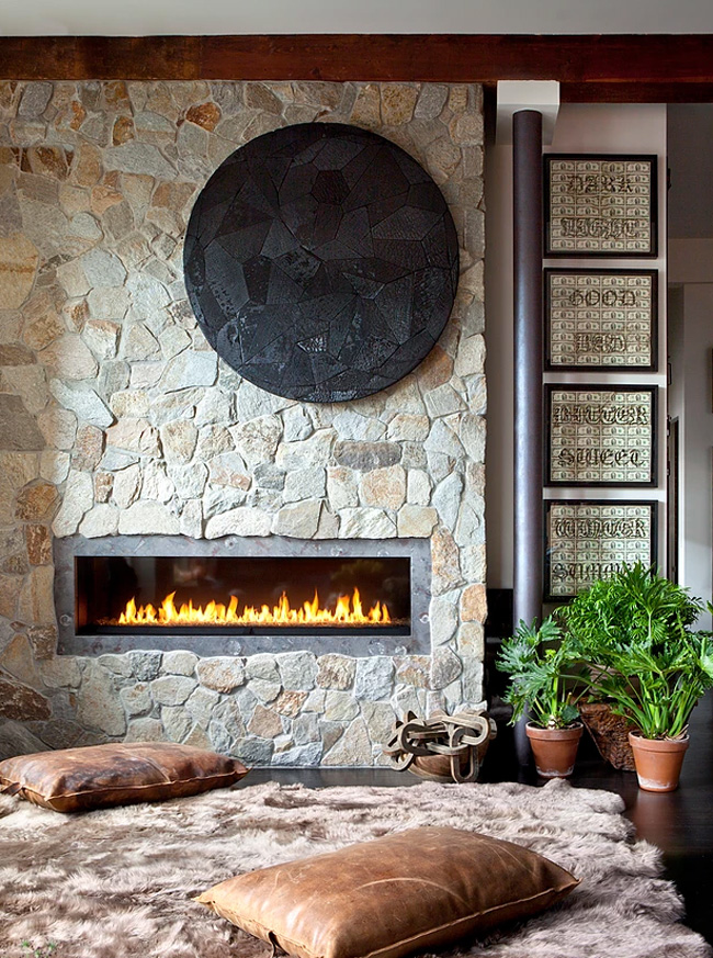 cozy built in fireplace There's a fireplace built-in a wall covered with real stone, here there's a fluffy rug and pilloows to enjoy it