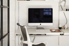 06 A small home office nook is done in pure white, with a chic modern chair and some shelves