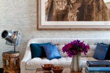 06 This textural sofa contrasts a stone coffee table and a gorgeous horse photo on the wall