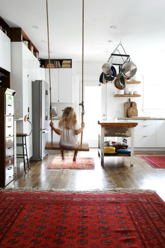 hang a swing for your kids in the kitchen, so that when you cook, they could stay close without disturbing you