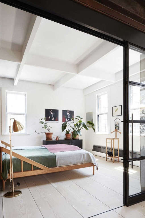 The master bedroom is filled with light and looks very inviting, there are some cute contrasting features
