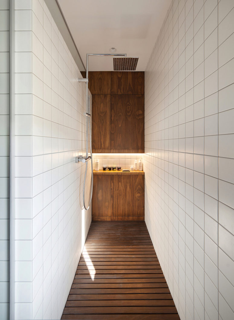 The shower has this grid floor designed specifically with the clients’ dogs in mind