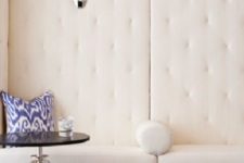 11 creamy upholstered walls make the space chic, light-filled and absorb the sound
