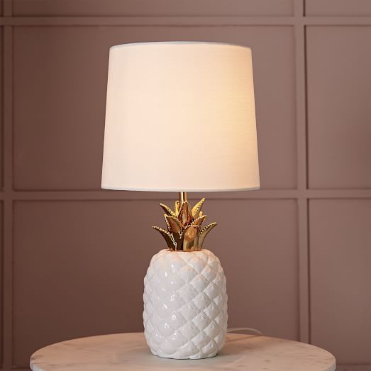 ceramic pineapple table lamp with a neutral lampshade