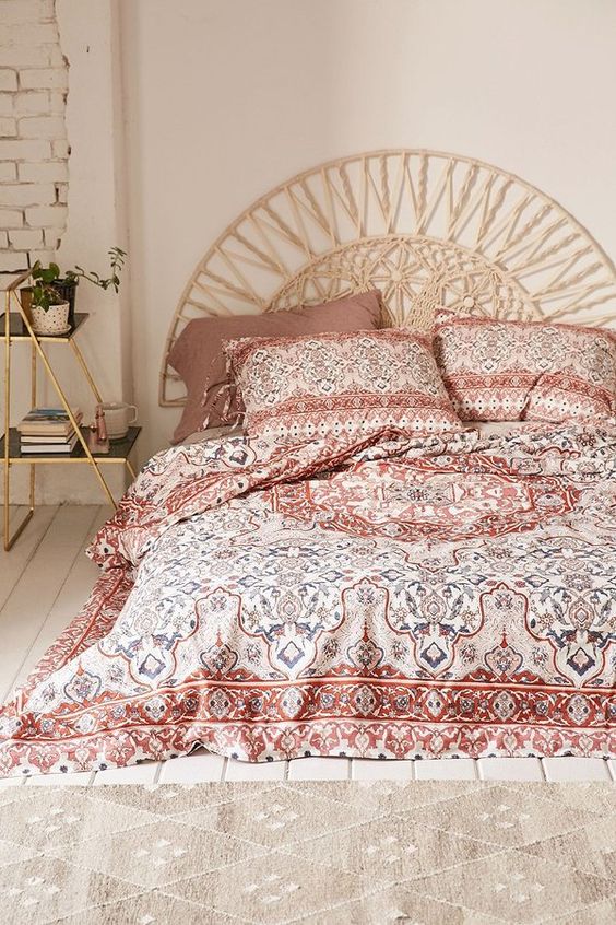 mauve, red, white and blue bedding with ethnic prints
