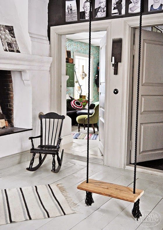 traditional Scandinavian interior with a swing as a fireplace seat