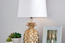 19 gold pineapple table lamp with a neutral lampshade will add glam