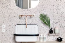 20 white terrazzo with black dots and copper fixtures for a a chic look