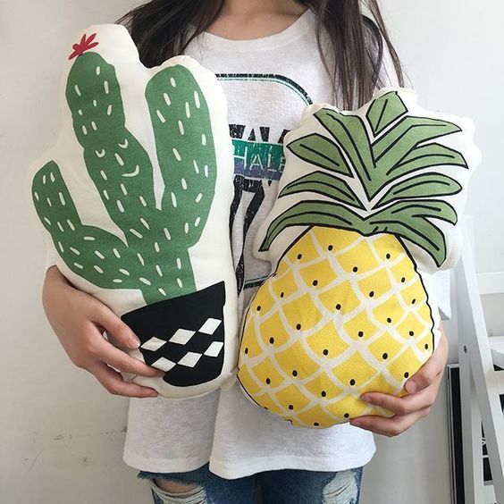 a cactus and a pineapple pillow for fun summer home decor
