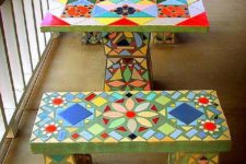 22 a colorful mosaic table and benches with a retro feel and bold patterns