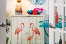 22 a small cabinet with pink flamingoes will add a whimsy touch