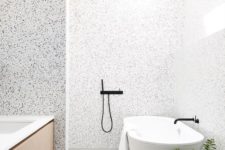 23 lighter terrazzo in the shower and bathtub zone and darker in the sink zone